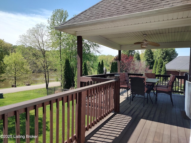 3501 Hardwood Forest Dr, Louisville, KY 40214 - wooden terrace with outdoor dining area, a ceiling fan, and a lawn