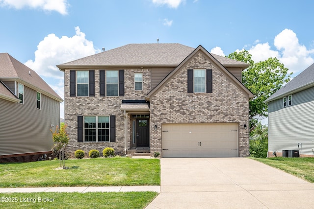 14341 Halden Ridge Way, Louisville, KY 40245 - view of front facade featuring concrete driveway, a front lawn, central air condition unit, a garage, and brick siding