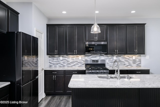 14341 Halden Ridge Way, Louisville, KY 40245 - kitchen with stainless steel appliances, a sink, light stone countertops, dark wood-type flooring, and recessed lighting