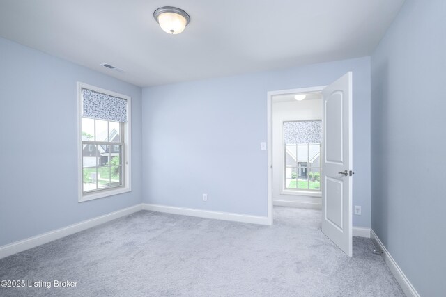 14341 Halden Ridge Way, Louisville, KY 40245 - empty room with healthy amount of natural light, baseboards, and carpet floors