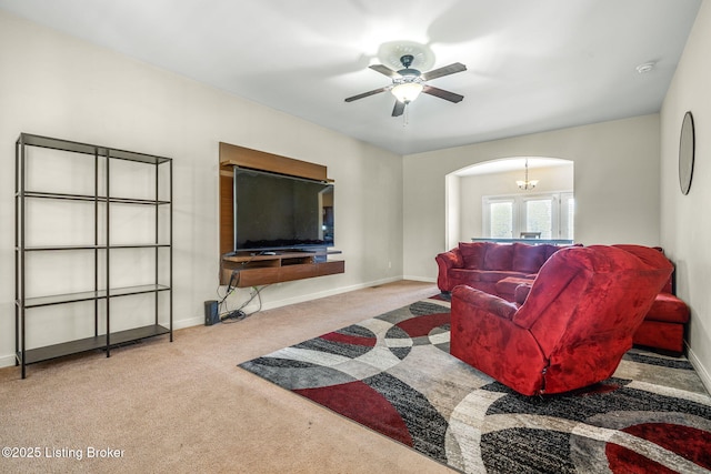 218 Sangria Dr, Vine Grove, KY 40175 - living room with arched walkways, carpet floors, a ceiling fan, and baseboards