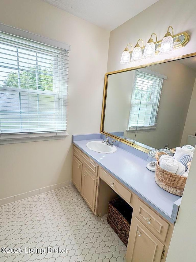 8602 Banbridge Rd, Louisville, KY 40242 - bathroom with healthy amount of natural light, vanity, and baseboards