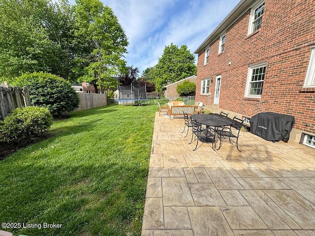 8602 Banbridge Rd, Louisville, KY 40242 - view of yard featuring a trampoline, a patio, and outdoor dining space