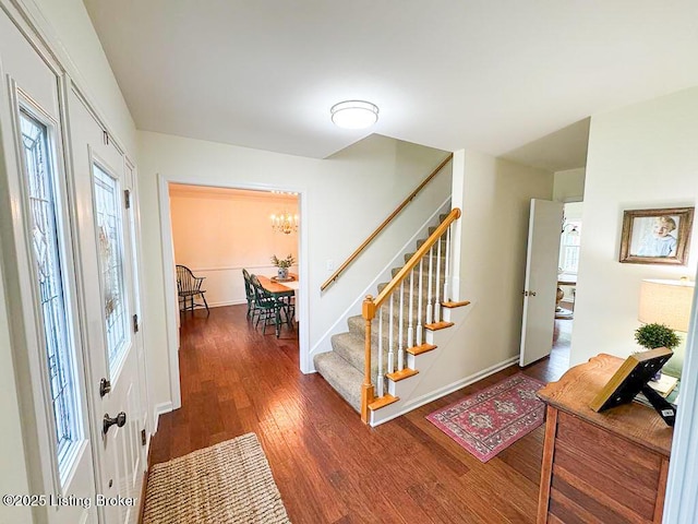 8602 Banbridge Rd, Louisville, KY 40242 - entrance foyer with stairway, wood finished floors, a chandelier, and baseboards
