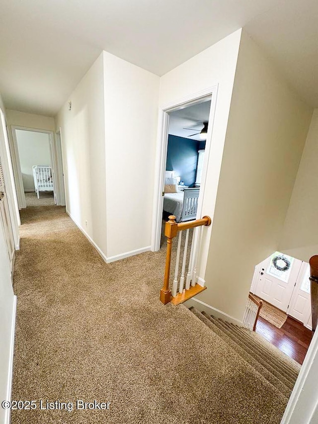 8602 Banbridge Rd, Louisville, KY 40242 - hall with baseboards, carpet floors, and an upstairs landing