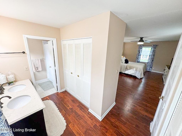 8602 Banbridge Rd, Louisville, KY 40242 - ensuite bathroom featuring wood finished floors, ceiling fan, and baseboards
