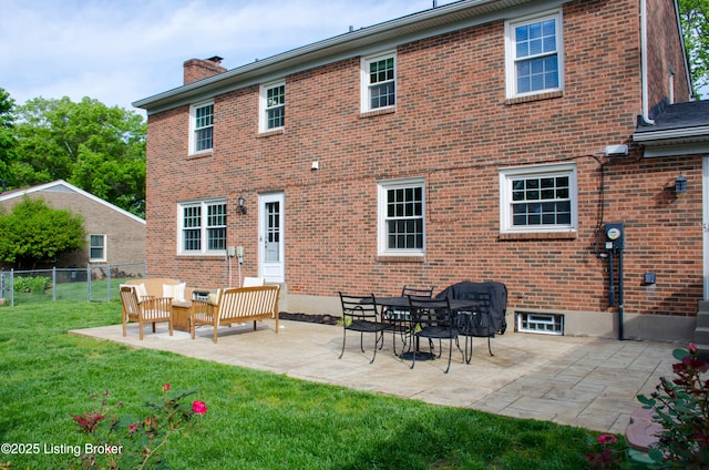 8602 Banbridge Rd, Louisville, KY 40242 - rear view of property featuring brick siding, a chimney, and a patio