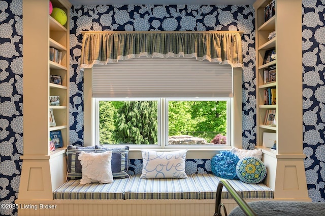 sitting room featuring wallpapered walls