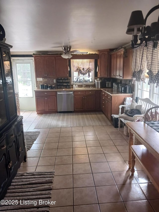 7702 Edna M Rd, Louisville, KY 40258 - kitchen featuring dishwasher, light tile patterned floors, ceiling fan, light countertops, and a sink