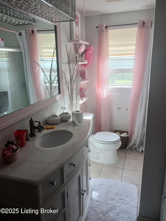 7702 Edna M Rd, Louisville, KY 40258 - bathroom featuring tile patterned floors, toilet, and vanity