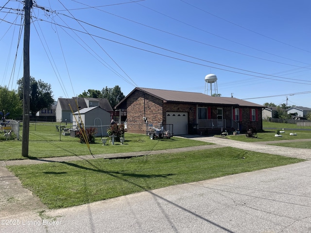 100 Monroe St, Radcliff, KY 40160 - view of front of house featuring a garage, brick siding, driveway, and a metal roof