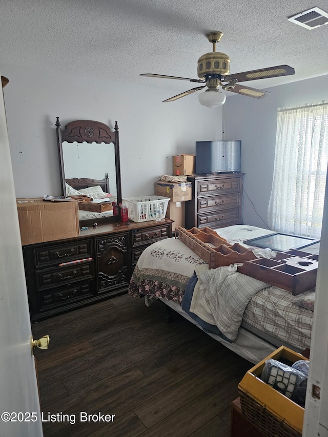 100 Monroe St, Radcliff, KY 40160 - bedroom with wood finished floors, a textured ceiling, and ceiling fan