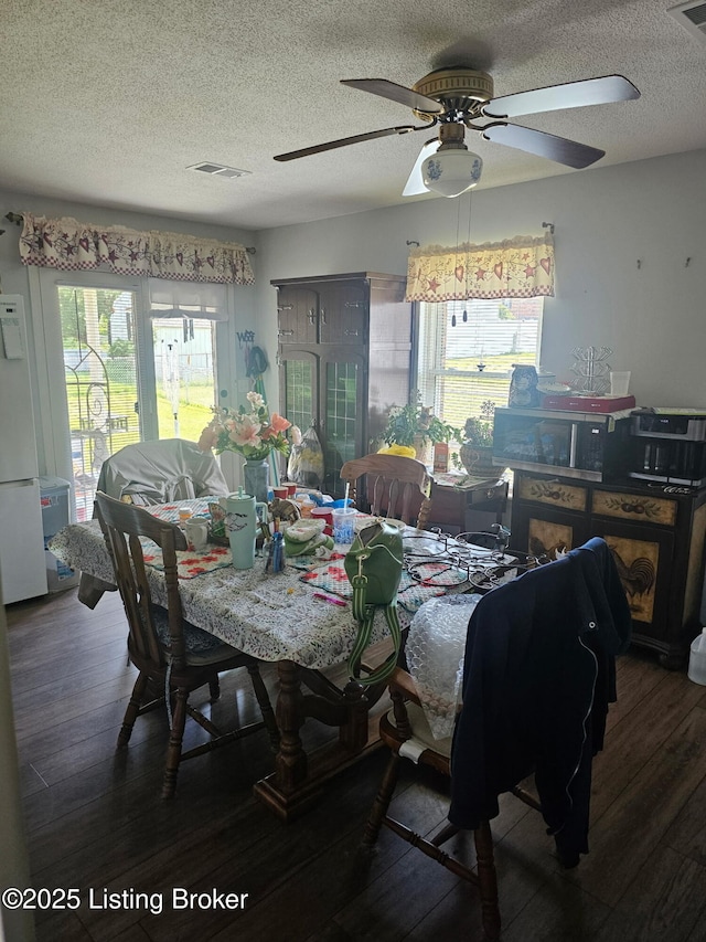 100 Monroe St, Radcliff, KY 40160 - dining area featuring wood finished floors, a textured ceiling, and ceiling fan