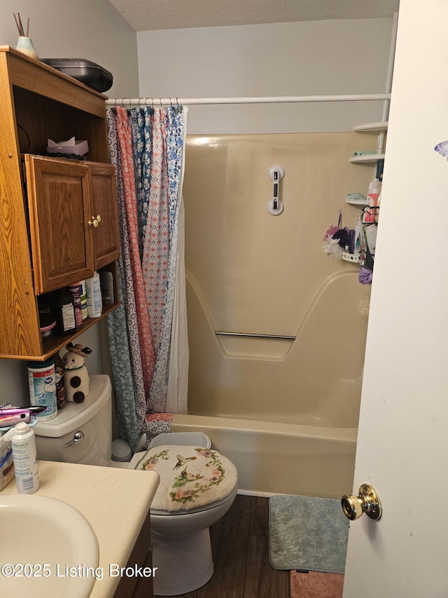 100 Monroe St, Radcliff, KY 40160 - bathroom with vanity, wood finished floors, and shower / bath combo
