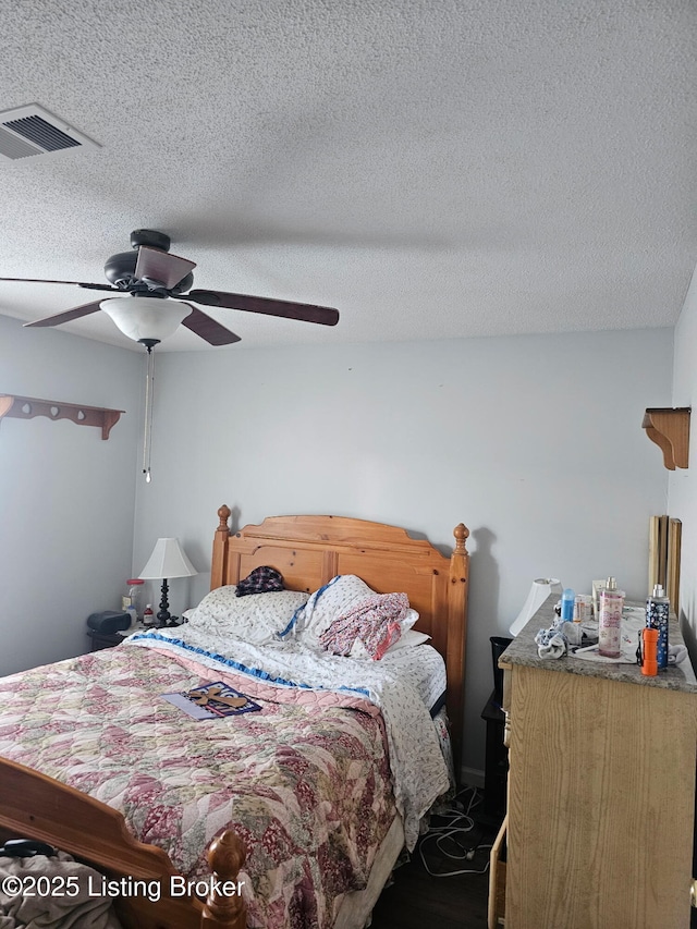 100 Monroe St, Radcliff, KY 40160 - bedroom featuring a textured ceiling, a ceiling fan, and dark wood-type flooring