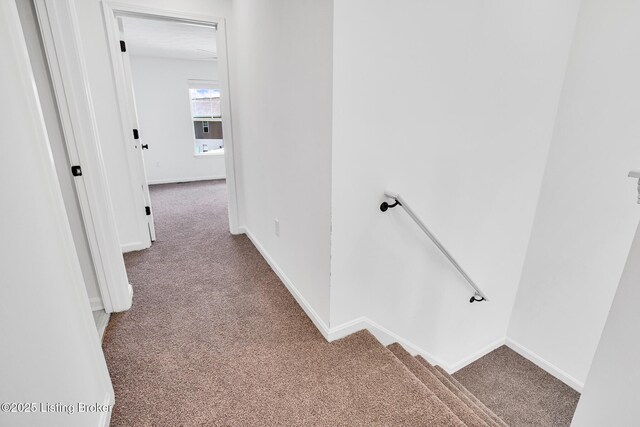 6111 Casper Dr, Louisville, KY 40258 - hall with carpet floors, an upstairs landing, and baseboards