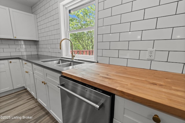 3304 S Camden Ln, Crestwood, KY 40014 - kitchen featuring stainless steel dishwasher, wooden counters, a sink, backsplash, and white cabinets