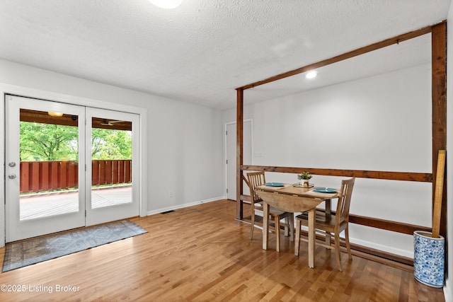 3304 S Camden Ln, Crestwood, KY 40014 - dining space with light wood-style flooring, recessed lighting, a textured ceiling, and baseboards