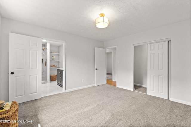3304 S Camden Ln, Crestwood, KY 40014 - unfurnished bedroom with carpet, a closet, a textured ceiling, baseboards, and ensuite bathroom