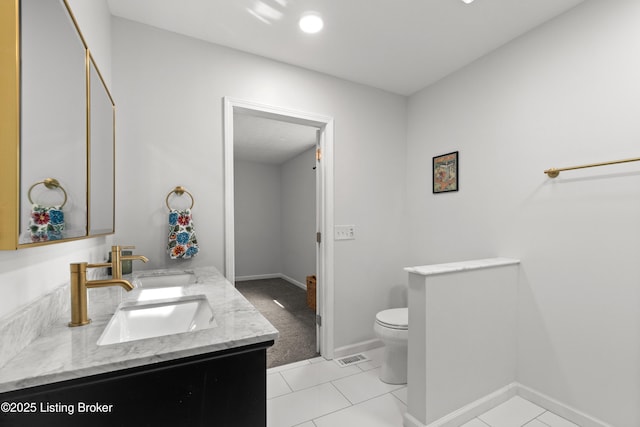 3304 S Camden Ln, Crestwood, KY 40014 - bathroom featuring toilet, double vanity, tile patterned floors, and baseboards