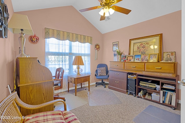 carpeted office space with lofted ceiling, ceiling fan, and baseboards
