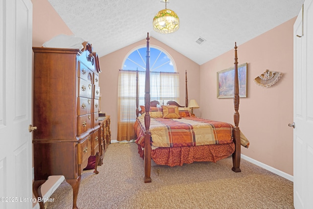 carpeted bedroom featuring vaulted ceiling, baseboards, and a textured ceiling