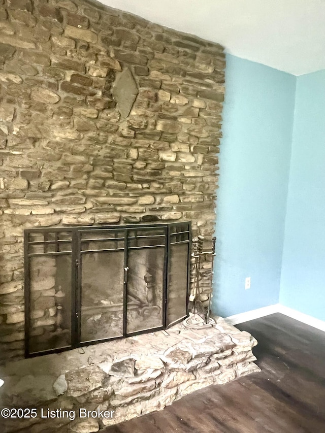 2227 Bradford Dr, Louisville, KY 40218 - detailed view of wood finished floors, baseboards, and a fireplace
