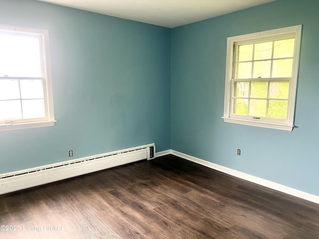 2227 Bradford Dr, Louisville, KY 40218 - unfurnished room featuring a baseboard radiator, dark wood-style flooring, baseboards, and healthy amount of natural light