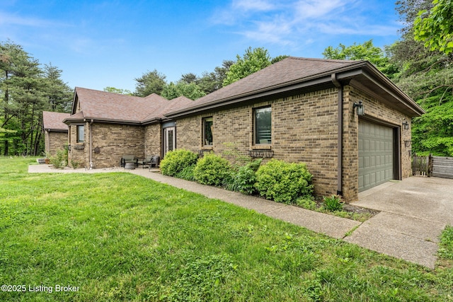 1093 W Bryan Rd, Elizabethtown, KY 42701 - ranch-style house with brick siding, driveway, a front yard, and an attached garage