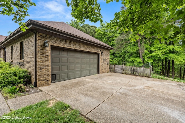 1093 W Bryan Rd, Elizabethtown, KY 42701 - garage with fence and concrete driveway