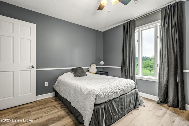 1093 W Bryan Rd, Elizabethtown, KY 42701 - bedroom with wood finished floors, baseboards, and a ceiling fan