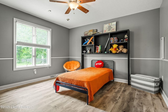 1093 W Bryan Rd, Elizabethtown, KY 42701 - bedroom with wood finished floors, baseboards, and ceiling fan
