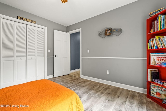 1093 W Bryan Rd, Elizabethtown, KY 42701 - bedroom with a closet, wood finished floors, and baseboards