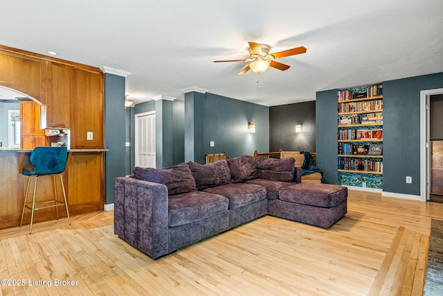 1093 W Bryan Rd, Elizabethtown, KY 42701 - living room with ceiling fan, light wood-type flooring, built in features, and arched walkways