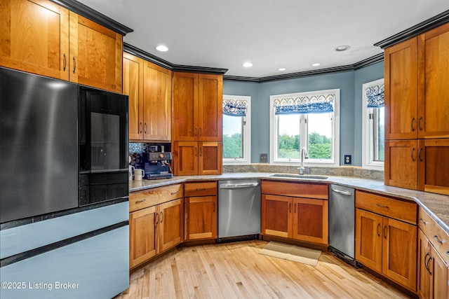1093 W Bryan Rd, Elizabethtown, KY 42701 - kitchen featuring stainless steel dishwasher, a sink, black refrigerator, ornamental molding, and light wood-style flooring