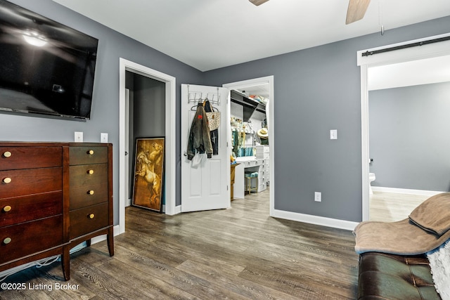 1093 W Bryan Rd, Elizabethtown, KY 42701 - sitting room with a ceiling fan, wood finished floors, a barn door, and baseboards