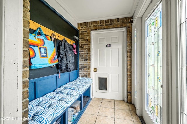 1093 W Bryan Rd, Elizabethtown, KY 42701 - mudroom featuring brick wall, crown molding, and tile patterned flooring