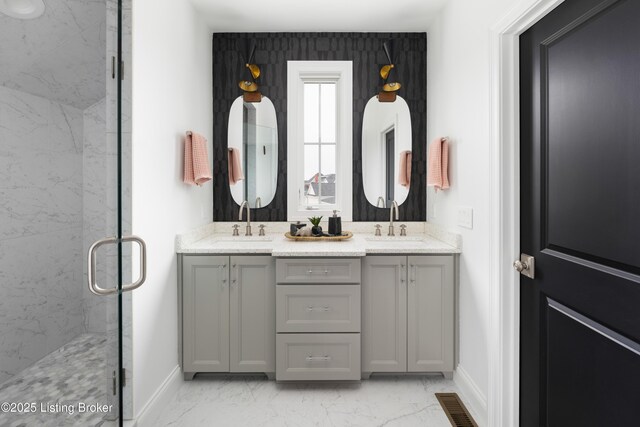 11006 Monkshood Dr, Prospect, KY 40059 - bathroom featuring baseboards, marble look tile flooring, a marble finish shower, and double vanity