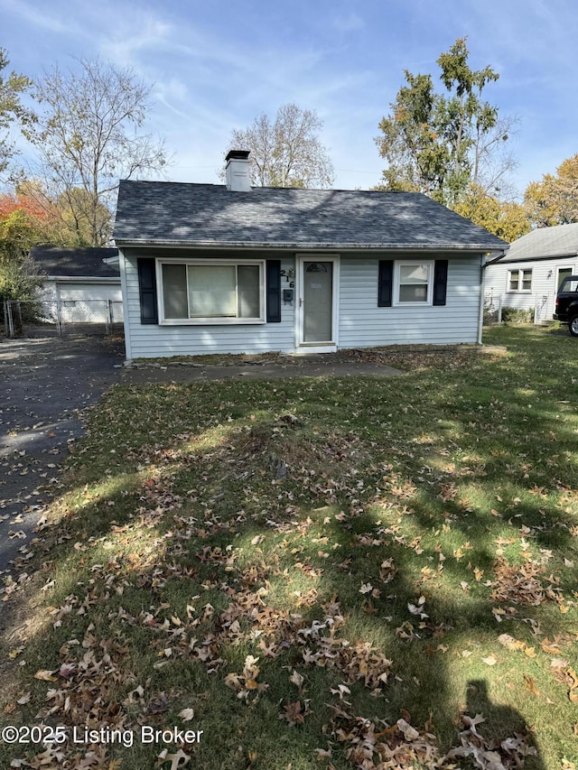 216 Bonnie Ln, Louisville, KY 40218 - view of front of home with a chimney and a front yard