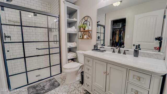 116 N Howard St, Bardstown, KY 40004 - full bathroom with a shower stall, toilet, vanity, tile patterned flooring, and a spacious closet