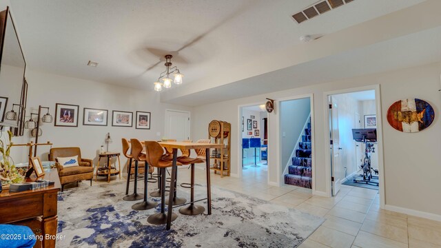 116 N Howard St, Bardstown, KY 40004 - dining space featuring stairway, light tile patterned flooring, and baseboards