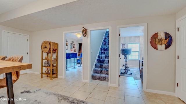 116 N Howard St, Bardstown, KY 40004 - interior space with stairway, light tile patterned floors, and baseboards