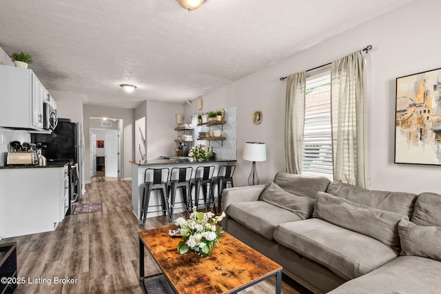 1136 Euclid Ave, Louisville, KY 40208 - living room featuring dark wood-style floors and a textured ceiling
