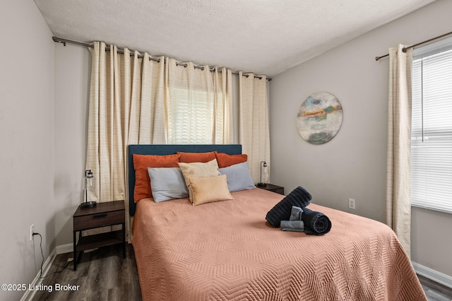 1136 Euclid Ave, Louisville, KY 40208 - bedroom with wood finished floors, baseboards, and a textured ceiling