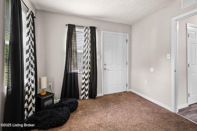 1136 Euclid Ave, Louisville, KY 40208 - carpeted entrance foyer featuring baseboards and a textured ceiling