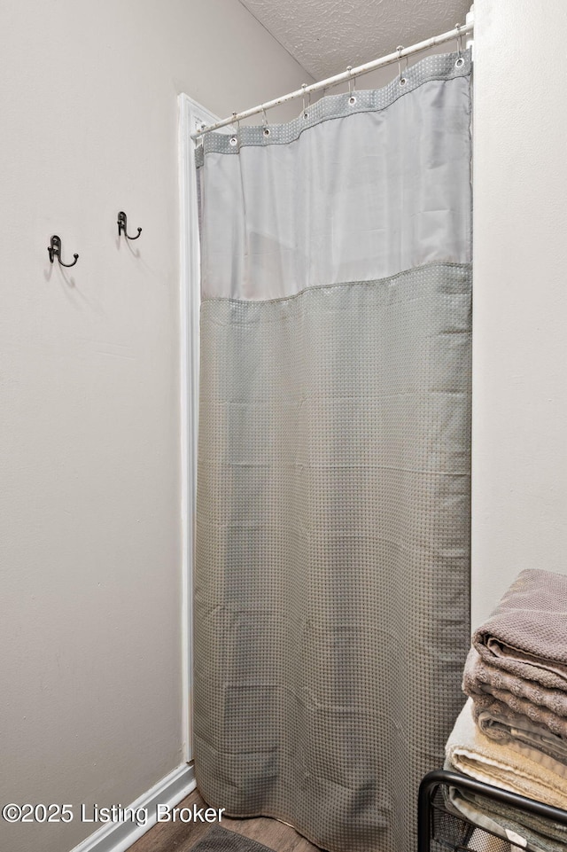 1136 Euclid Ave, Louisville, KY 40208 - bathroom featuring a textured ceiling and a shower with shower curtain