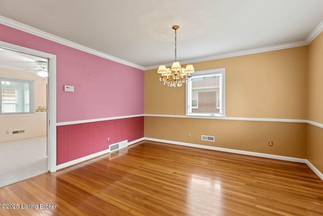 3531 Graham Rd, Louisville, KY 40207 - empty room with a chandelier, crown molding, and wood finished floors