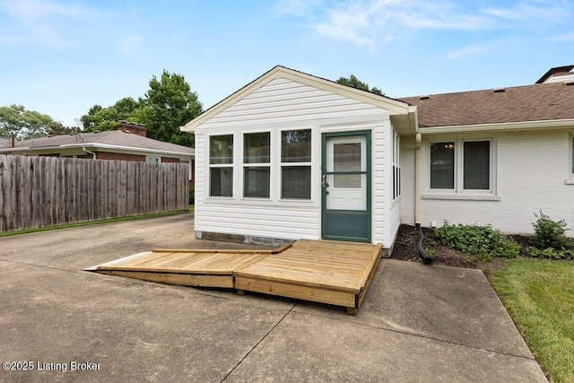 3531 Graham Rd, Louisville, KY 40207 - view of exterior entry featuring a shingled roof and brick siding