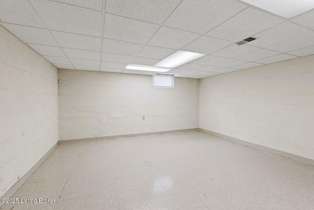 3531 Graham Rd, Louisville, KY 40207 - basement featuring a paneled ceiling, tile patterned floors, and concrete block wall