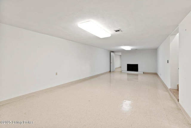 3531 Graham Rd, Louisville, KY 40207 - finished below grade area with tile patterned floors and a fireplace with raised hearth